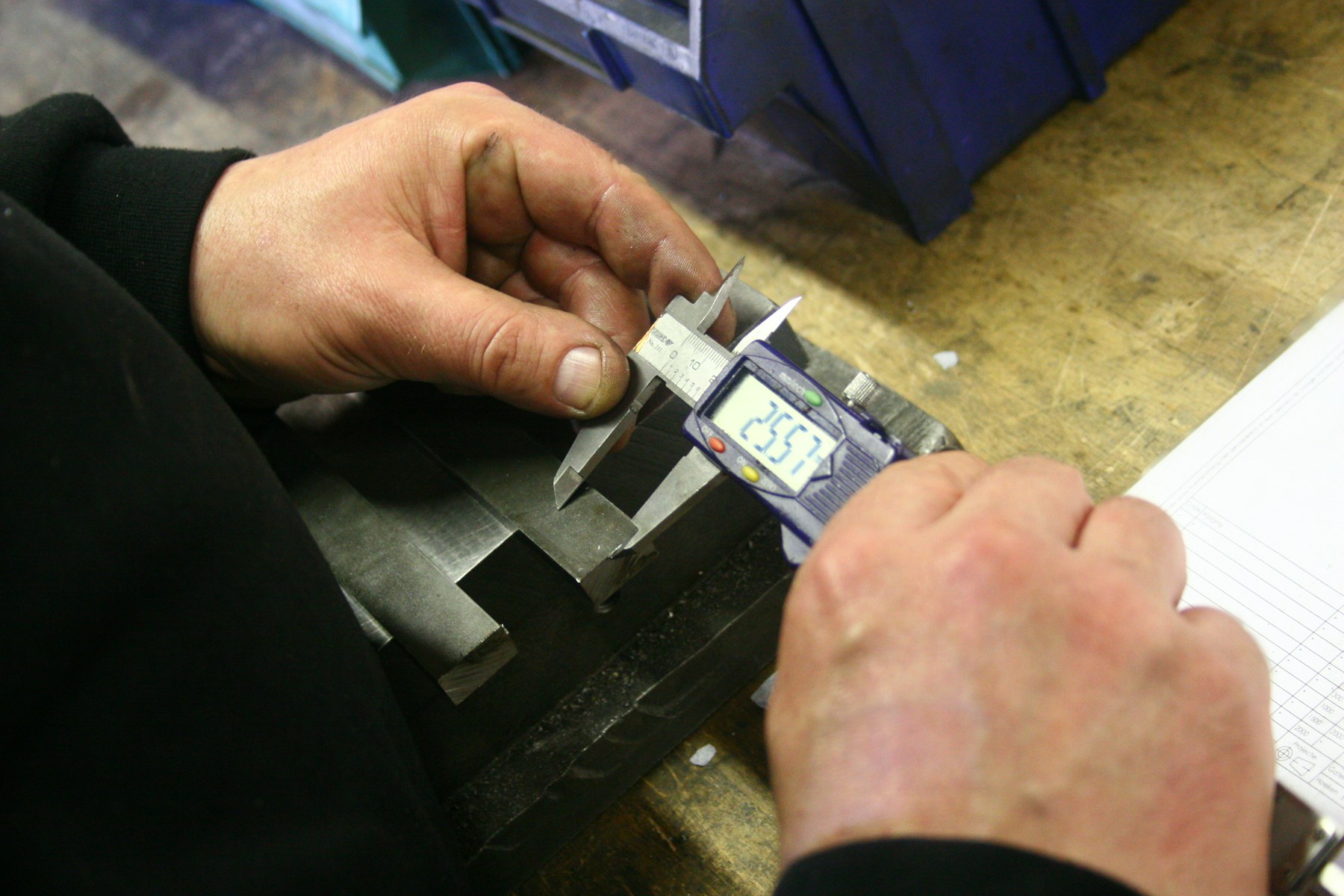 A precision metal component undergoing a dimensional inspection